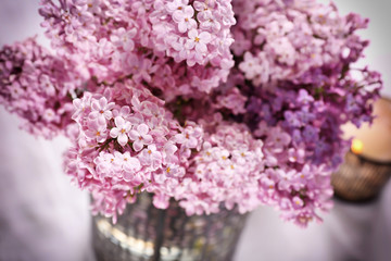 Beautiful lilac bouquet on blurred background, closeup