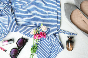 Clothes with accessories and flowers, flat lay