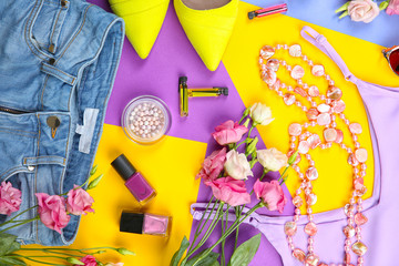 Clothes with flowers on yellow and lilac background