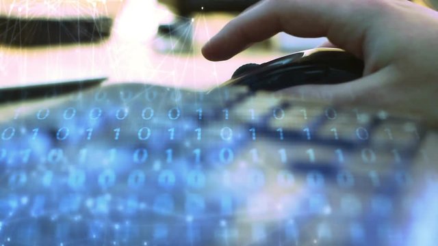 IT Computer concept - Man uses wireless mouse to create software code