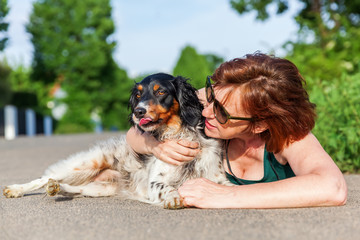 portrait of a mature woman with Brittany dog