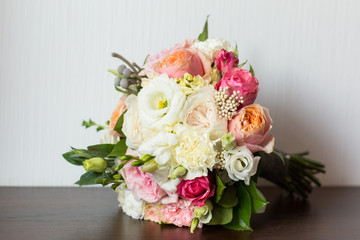 delicate wedding bouquet on brown background
