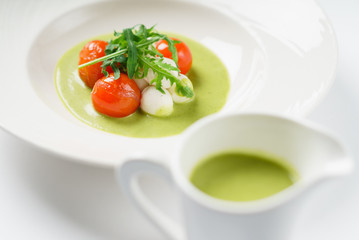 cream soup with tomato and mozzarella