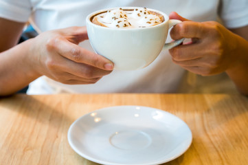 hot latte in her hand,Create 4 cat figures on a coffee bar by Barista.