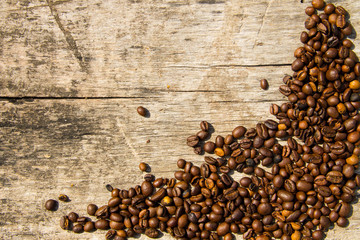 Coffee beans on wooden background