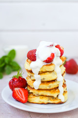 Syrniki (Cottage cheese pancakes, Fritters of cottage cheese) traditional Ukrainian and Russian cuisine.