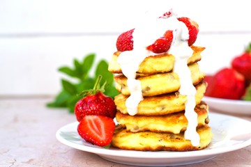 Syrniki (Cottage cheese pancakes, Fritters of cottage cheese) traditional Ukrainian and Russian cuisine.
