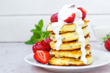 Syrniki (Cottage cheese pancakes, Fritters of cottage cheese) traditional Ukrainian and Russian cuisine.