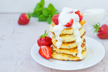 Syrniki (Cottage cheese pancakes, Fritters of cottage cheese) traditional Ukrainian and Russian cuisine.