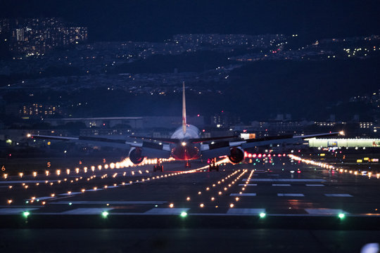 Airplane landing at the airport at night