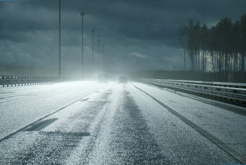 high-speed road after a rain with the falling rays of the sun