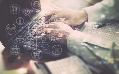 Hands of a businessman working on laptop in office.