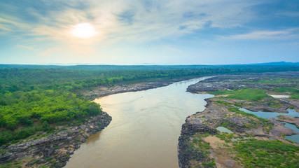 aerial photography around grand canyon in Mekong river. 3000 bok mean 3000 holes,holes eroded into the rock along Mekong river. color of water inside the holes after low tide is emerald green