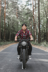 Fototapeta na wymiar Man seat on the motorcycle