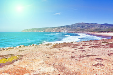 Cliffs and rocks on the Atlantic ocean coast in Sintra in a beautiful summer day. Portugal