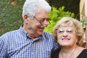 An elderly couple outdoors.