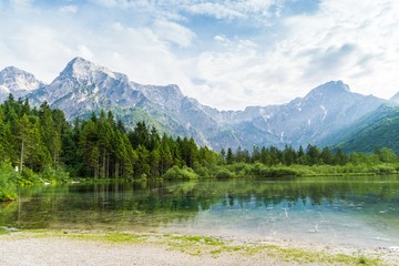 Naklejka na ściany i meble Alps mountains and lake in Almsee in Austria.