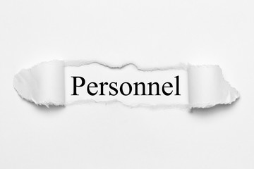 Obraz premium Personnel on white torn paper