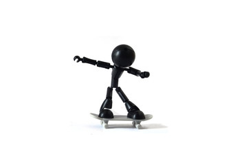 Black robot playing white skateboard isolated