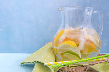 Lemonade pitcher with lemon, orange, lime slices