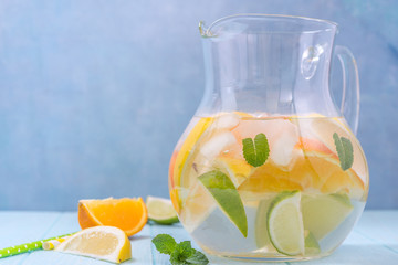 Lemonade pitcher with lemon, orange, lime slices
