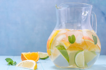 Lemonade pitcher with lemon, orange, lime slices