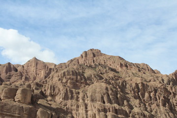 Fototapeta premium Brown Mountains against a Blue Sky in Xunhua County, Qinghai Province China Amdo Tibet Asia