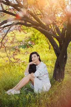 Woman in park. Pleasure of spring nature.