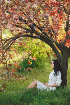 Woman in park. Pleasure of spring nature.