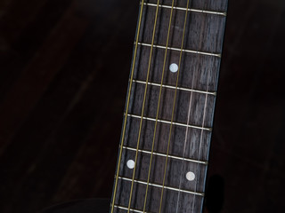 Detail shots of an acoustic  guitar, fretboard