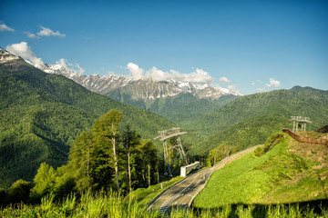 Road among the mountains in the summer. Rosa Khutor, Adler