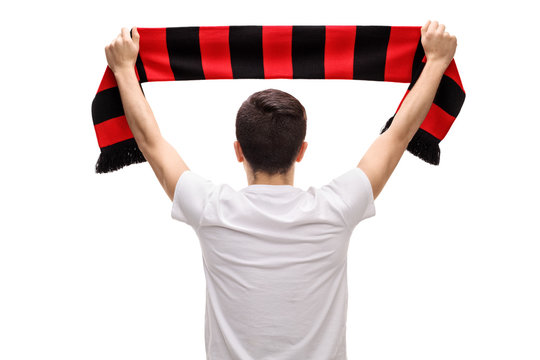 Rear view shot of teenage soccer fan holding scarf