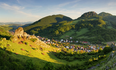 Beautiful landscape of valley in Slovakia mountains, small houses in village, rural scene, majestic picturesque view at sunset panorama
