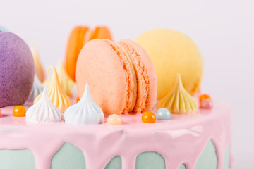 Obraz na płótnie Canvas Colorful Macaron Birthday Cake And Sweet Candy Topping