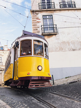 Famous vintage tram in the city center of Lisbon, Portugal in a summer day © kite_rin