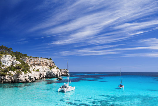Beautiful bay with sailing boats yacht, Menorca island, Spain. Yachting, travel and active lifestyle concept