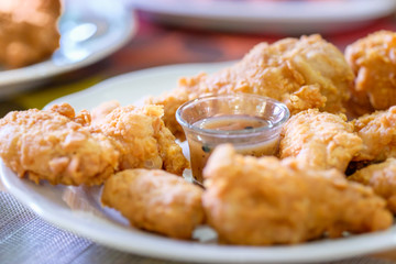 A plate of fresh, hot, crispy fried chicken