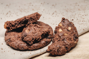 Pastry biscuits on linen napkin on wooden table