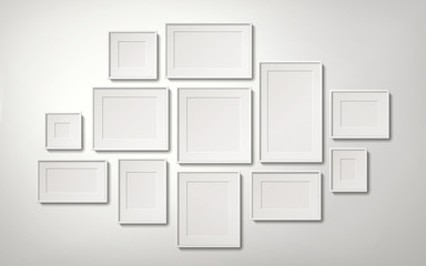 Fototapeta na wymiar Blank white picture frames