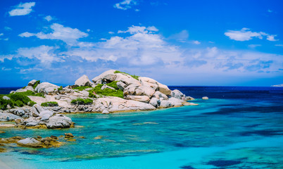 Bizarre granite rocks formation in amazing azure water on beautiful Sardinia island near Porto Pollo, Sargedna, Italy
