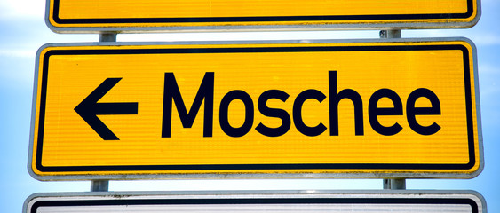 Close up of mosque sign board against cloudy sky