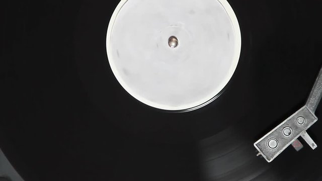 turntable with stylus running along a vinyl record