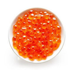 Bowl of red caviar isolated on white, from above