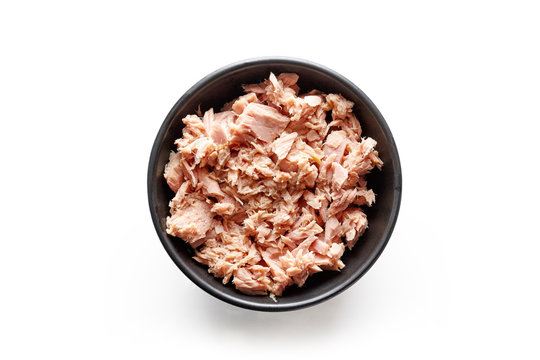 Bowl of canned tuna isolated on white, from above
