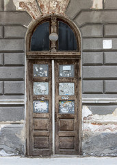 Old Dirty Wooden Door With Cracked Wall