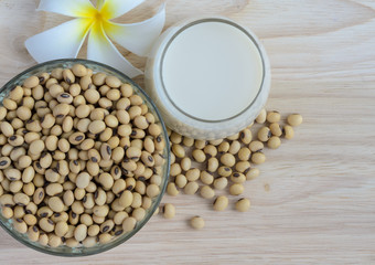 Fresh Soy milk (Soya milk) in a glass and organic soybean seeds