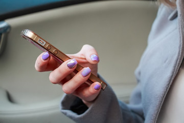 Fototapeta na wymiar Close up woman's hands hold smartphone