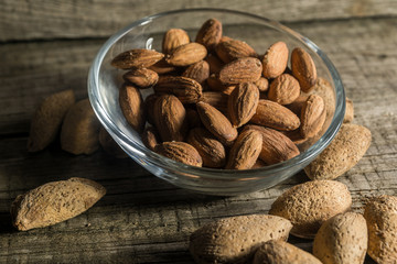 Top view of Almonds over rustic wooden background