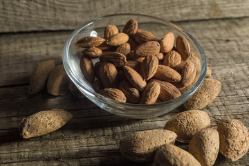 Top view of Almonds over rustic wooden background