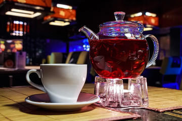 Close up transparent glass teapot in cafe